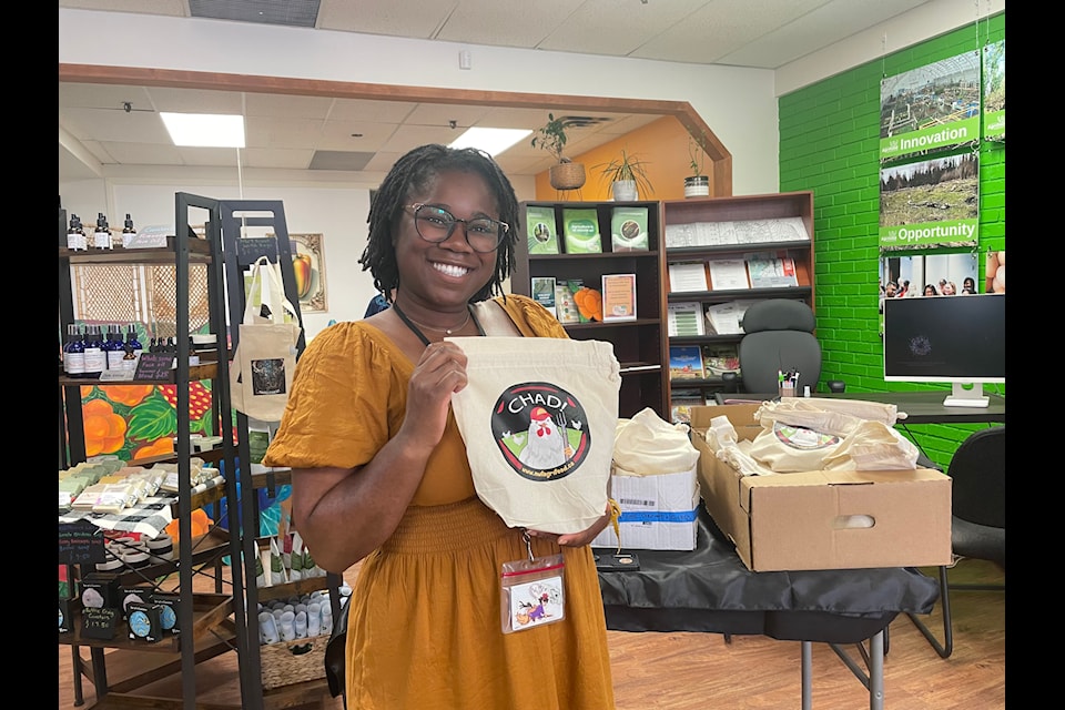 Olivia Williams has a veggie sandwich tucked inside one of the bags that the NWT Culinary Festival was giving away.