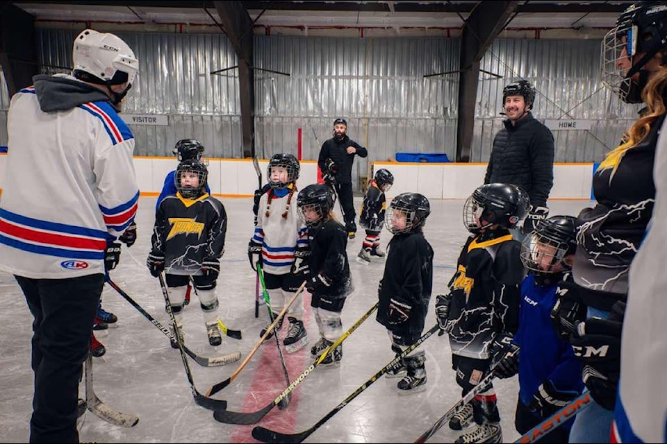 Jarred Pawlowski, far left, addresses a group of young players at the 2025 Sahtu Cup in Norman Wells. Photo courtesy of Josh Ferguson