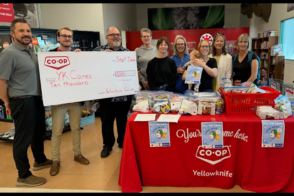 The Yellowknife Co-op grocery store presented a $10,000 cheque to Yk Cares on Saturday to support the purchase of food for school children on weekends when food might be scarce. From left, Jeff Kincaid, business development manager at Co-op; Devon Hodder, vice-president of the Yellowknife Co-op board; Justin Nelson, general manager of Co-op; Carolyn Cronk, Yk Cares volunteer; Amanda Annand, Yk Cares volunteer; Toni Riley, Yk Cares volunteer; Robyn Coleman, Yk Cares program coordinator; Jane Curran, Yk Cares volunteer and Dot Van Vliet, Yk Cares volunteer. Jill Westerman/ϳԹ photo