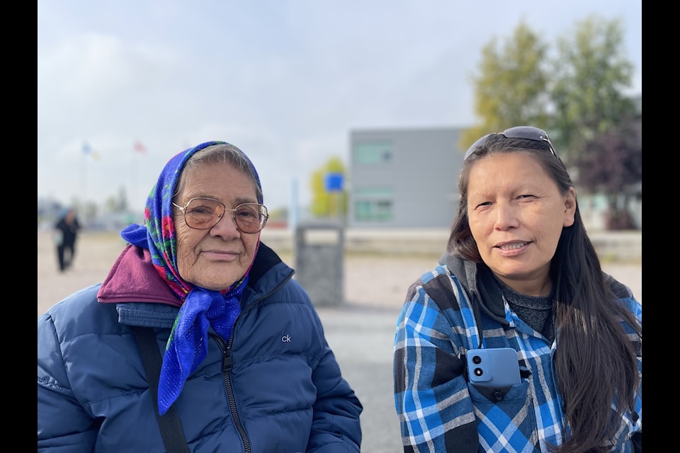 Elders Verna Crapeau, left, and Kathy Franki attended Ecole St. Patrick High School's feeding the fire ceremony to share stories and make offerings.