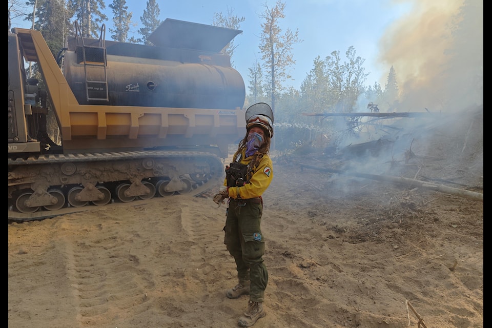 Yvonne Meulenbroek stands on a fire line in northern Alberta. The Norman Wells resident has travelled as far as Australia for her work. Photo courtesy of Yvonne Meulenbroek