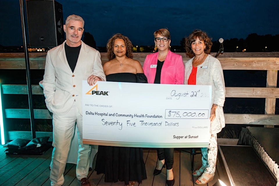 Peak Products founder and CEO John Gross and his wife Rose (left) present a $75,000 cheque to Delta Hospital and Community Health Foundation executive director Lisa Hoglund (second from right) and board chair Pam Paton (right) on the Tsawwassen First Nation boardwalk on Thursday, Aug. 22, 2024, proceeds from the inaugural "Supper at Sunset" event held that evening in support of the foundation's "Coming Home" capital campaign.