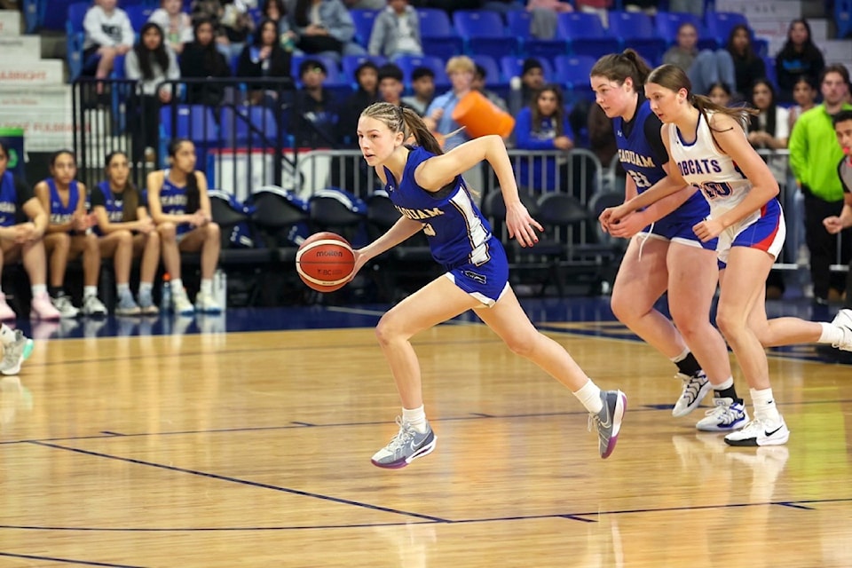 Callie Brost dribbles up court during the final game of the BC School Sports Girls 4A Basketball Provincial Tournament on March 1 at the Langley Events Centre.
