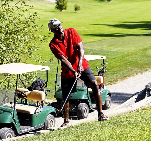 Al Lamons chips in during a previous F.U.B.A.R. charity golf tournament.