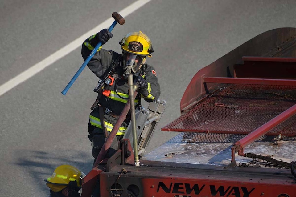 A garbage truck caught fire in Surrey Saturday evening. (Curtis Kreklau photos)