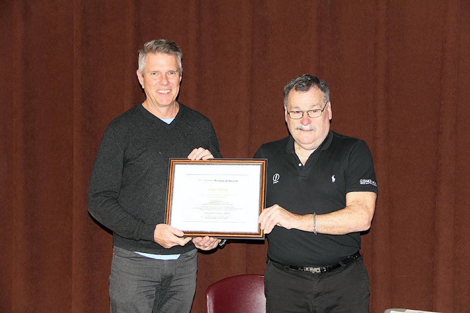 Surrey Historical Society president Michael Gibbs awards former MP John Aldag with a certificate of appreciation. (Photo: Malin Jordan)