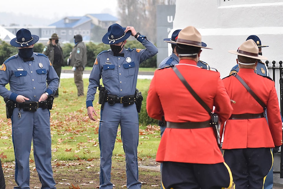 Surrey RCMP and Washington State Police raised both an American and Canadian flag at the Peace Arch Tuesday morning. (Aaron Hinks photos)