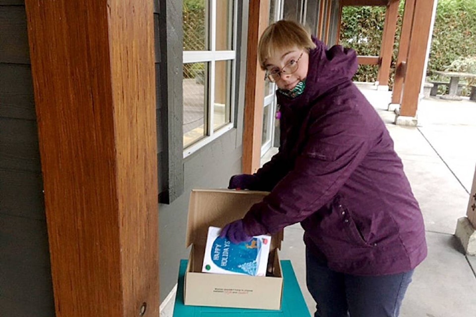 Jennifer Utendale drops off one of the handmade Christmas cards that were ultimately delivered to seniors at Westminster House retirement residence. (Contributed photo)