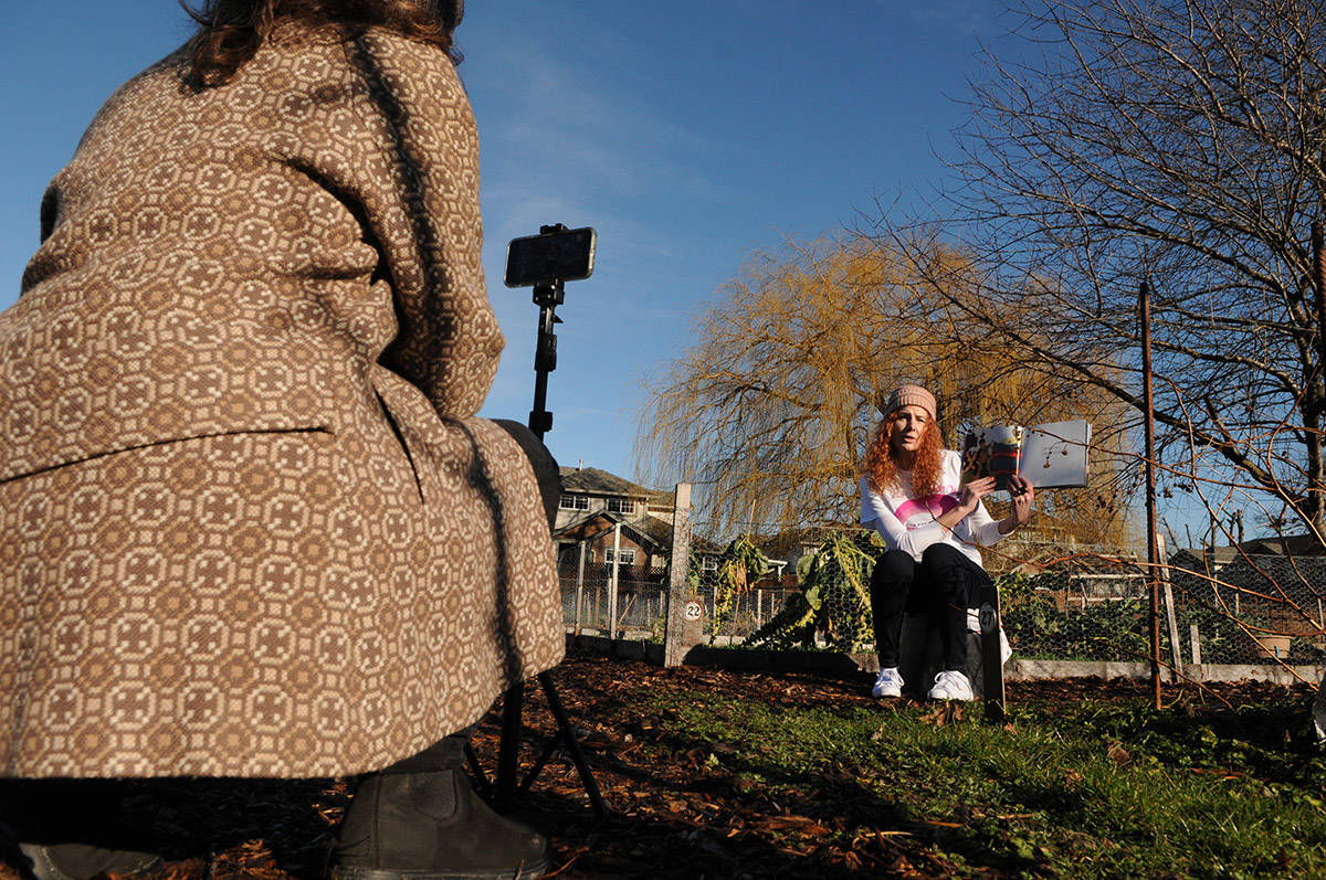 Julie Penner (right) and Janet Woyke, librarians with the Fraser Valley Regional Library in Chilliwack, film a storytime video on Feb. 3, 2021 for Anti-Bullying Day (Feb. 24). (Jenna Hauck/ Chilliwack Progress)