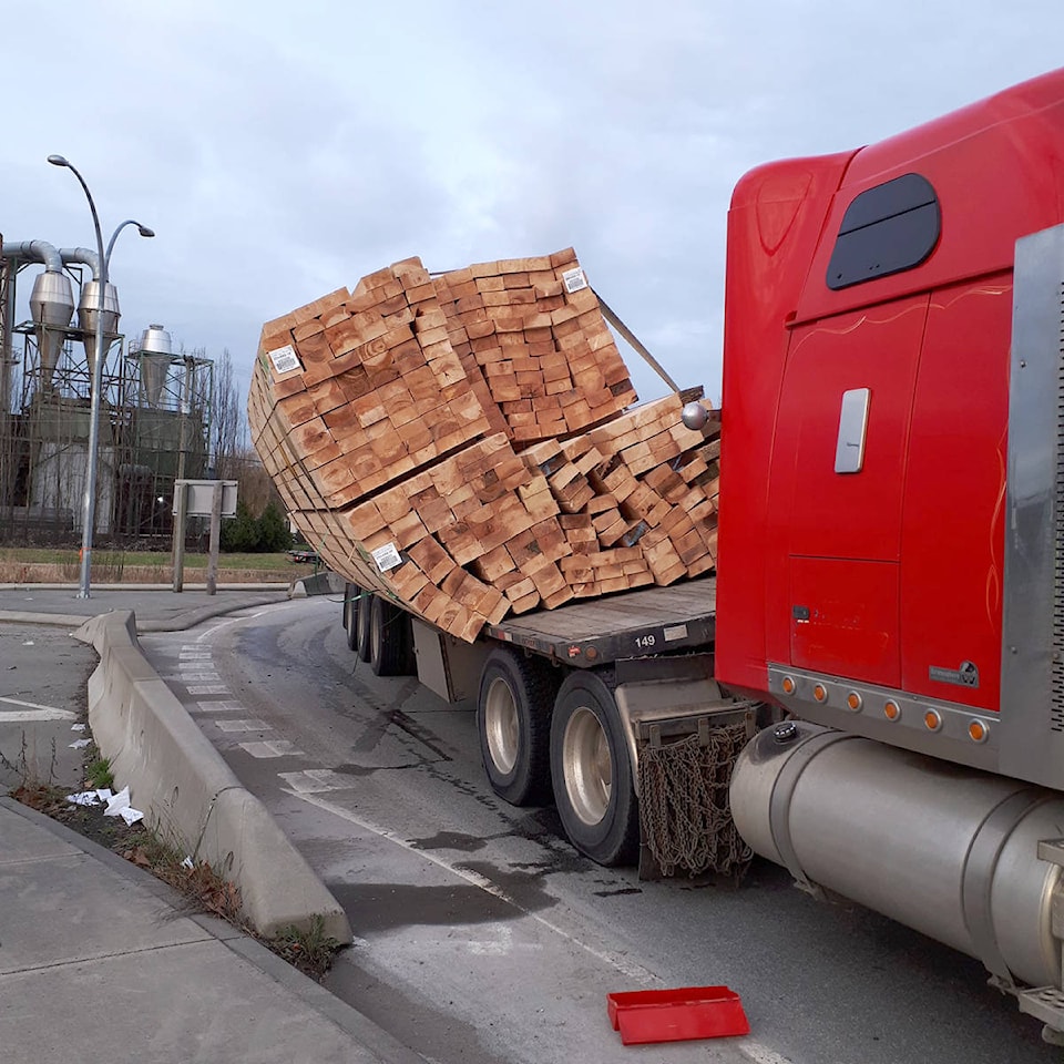 24356560_web1_210302-NDR-M-DPD-lumber-truck-shifted-load-WEB-SQUARE
