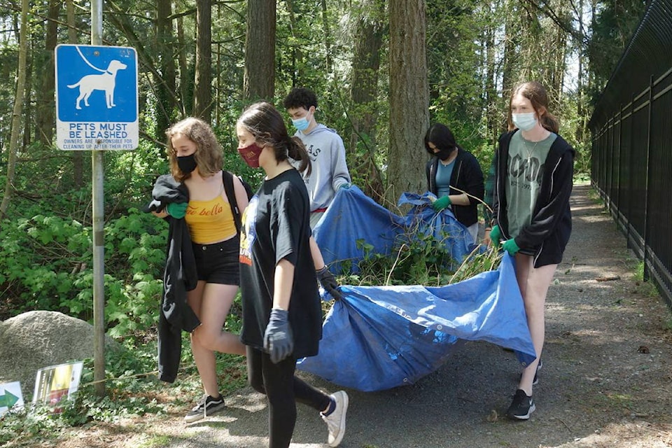 Students work with members of the Lower Mainland Green Team to remove invasive species from White Rock’s Ruth Johnson Park. (Contributed photos)
