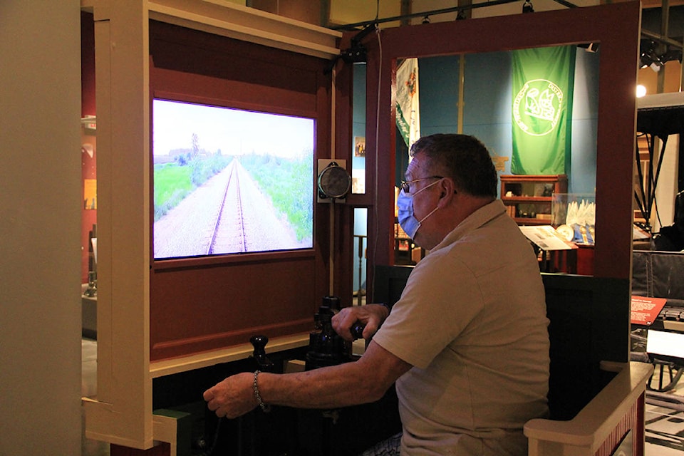 Michael Gibbs, co-chair of communications for the Fraser Valley Heritage Railway Society, drives a virtual train that is part of a new interactive train exhibit at the Museum of Surrey. The exhibit opens June 2. (Photo: Malin Jordan)