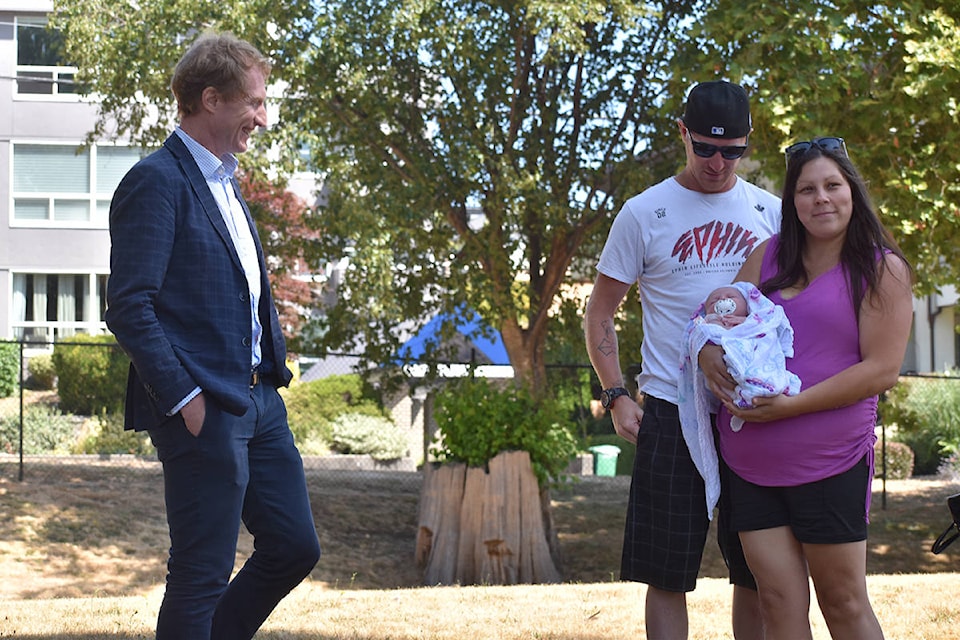 Indigenous Services minister Marc Miller meets the youngest Semiahmoo First Nation member, one-month-old Arya Kampen (with parents Daniel Kampen and Samantha Wells) at a Semiahmoo Park celebration to mark the removal of the nation’s boil water advisory, after 16 years. (Alex Browne photo)
