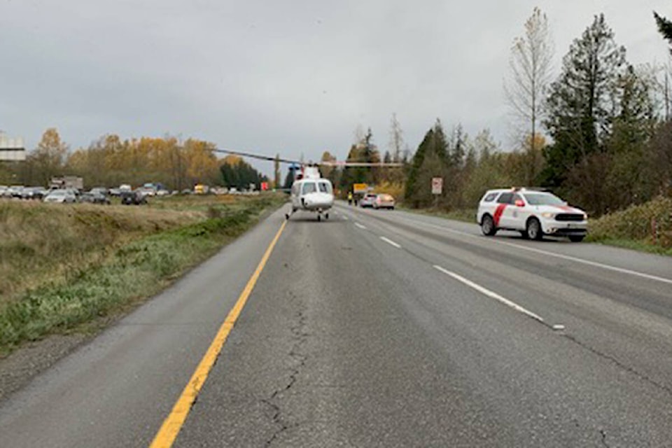 Emergency crews are on scene of a vehicle fire, westbound at 264th Street on the Trans Canada Highway in Langley Tuesday afternoon, Nov. 9, 2021. The highway was shut down to make way for an air ambulance. (TOL Fire/Special to Langley Advance Times)
