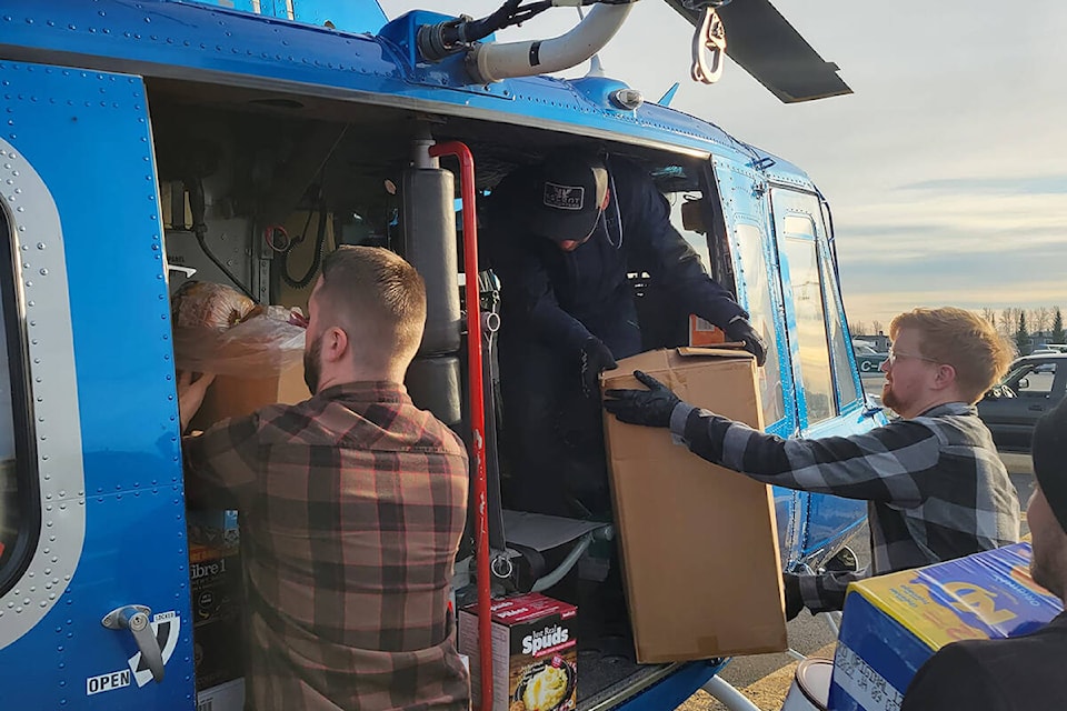 Volunteers have been loading helicopters with supplies and essentials for flood-impacted people in Hope, Merritt, Boston Bar and other regions. (Jeremy Prasad/Special to The News)