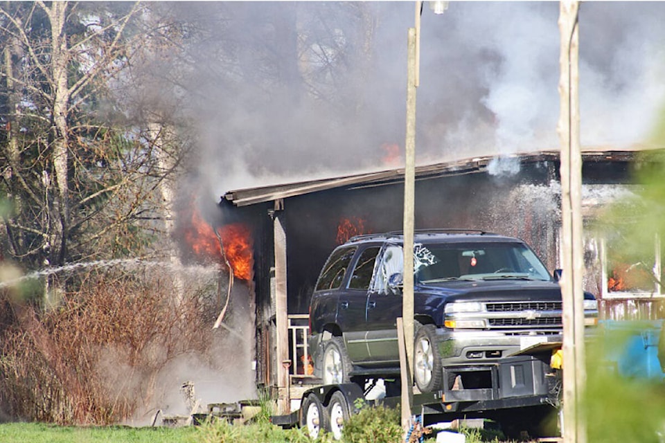 Surrey firefighters battled a blaze on 80th Avenue between 170th and 176th Streets Dec. 3. (Photo: Shane MacKichan)