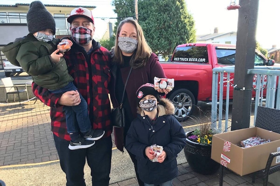 The Carpenter family – Mike, Danielle, Colton and Wyatt –regularly delivers gifts to White Rock Seniors Village, and this Christmas was no exception. (Contributed photo)