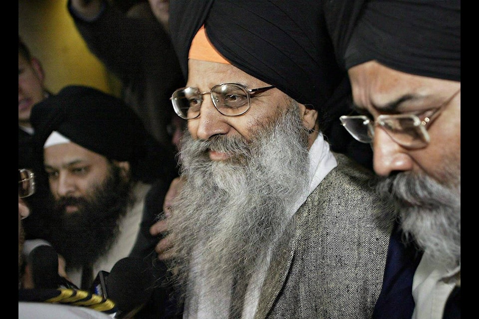 Ripudaman Singh Malik (centre) leaves B.C. Supreme Court in Vancouver, B.C. with his supporters after he was found not guilty in the bombing of an Air India flight 182 in 1985, Wednesday March 16, 2005. Sources say Malik was killed shooting in Surrey, B.C. THE CANADIAN PRESS/ Richard Lam