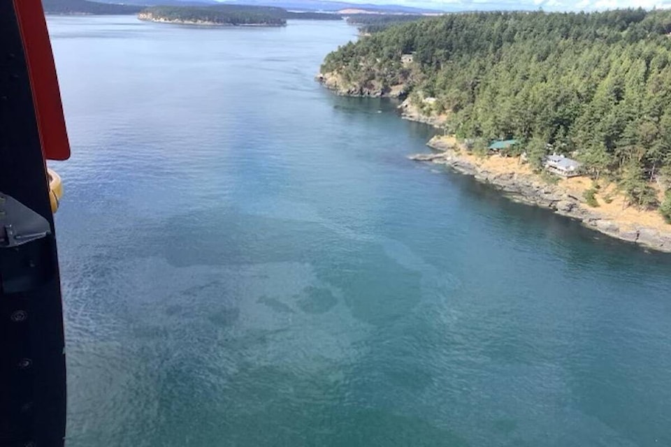 A fishing boat with thousands of litres of fuel onboard sank between Greater Victoria and Washington state on Aug. 13. A sheen spanning more than three kilometres was reported to have entered Canadian waters by that evening. (U.S. Coast Guard Pacific West Coast district/ Twitter)