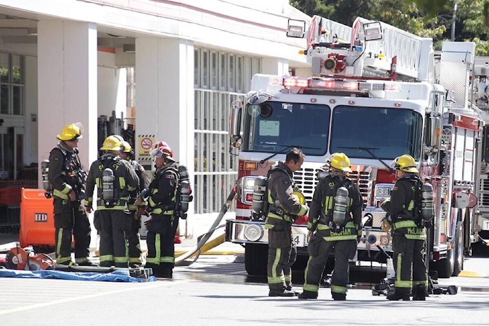 Firefighters at a Home Depot store in North Surrey on Monday, Aug. 22. (Photo: Shane MacKichan)