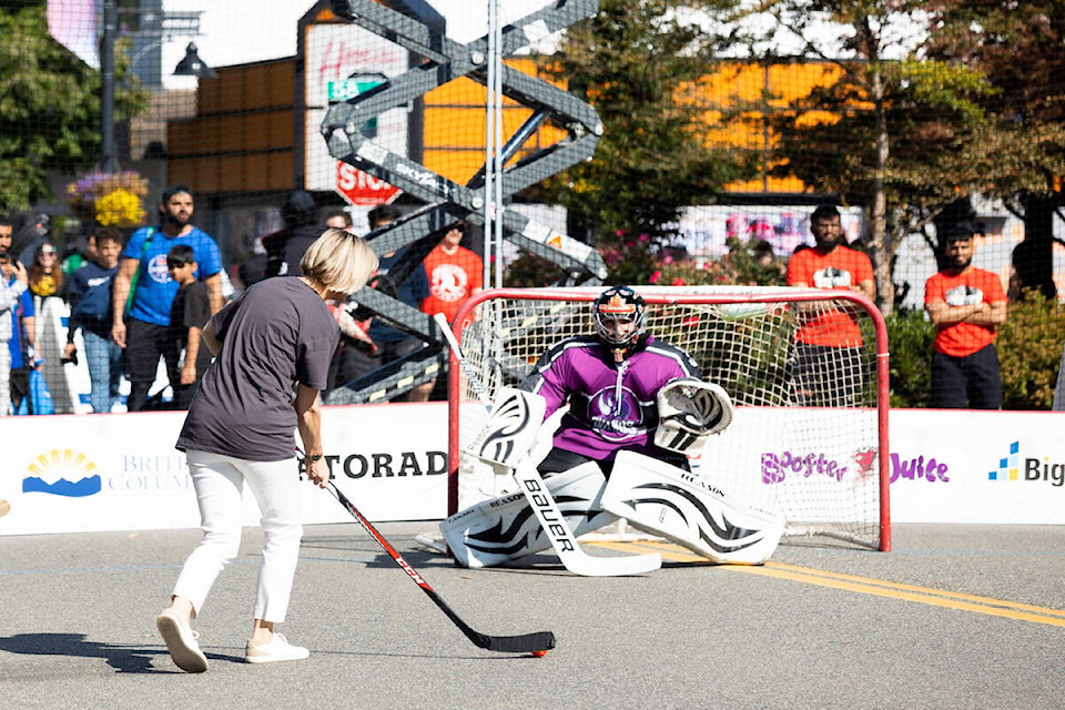 Coun. Allison Patton takes a shot at the net during the celebrity hockey game at Play On! in Surrey on Saturday, Sept. 24, 2022. (Photo: Anna Burns)
