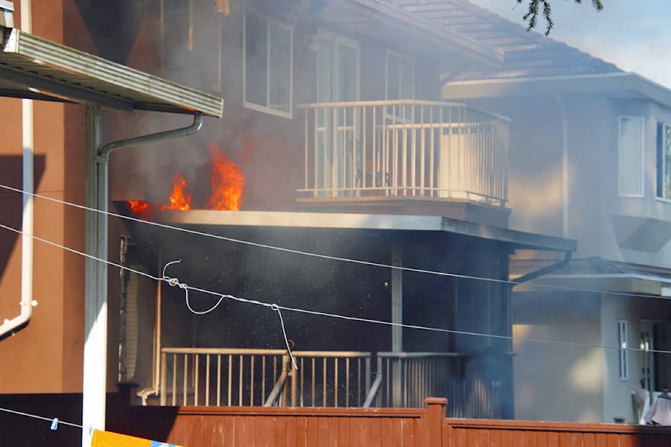 Surrey fire crews were called to a fire at a home in Newton just before noon on Monday. (Shane McKichan photo)
