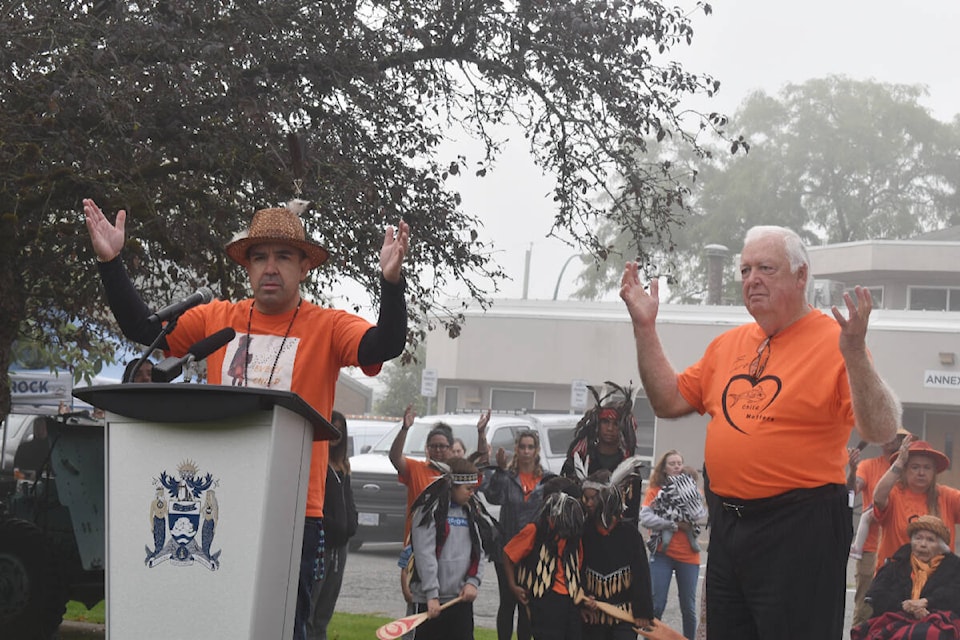 Joined by members of Semiahmoo First Nation and White Rock Mayor Darryl Walker, (right) Chief Harley Chappell spoke at the raising of the SFN flag outside City Hall on Friday, Sept. 30. The ceremony was one of a pair of events in the city to mark Canada’s second annual National Day for Truth and Reconciliation. The flag will fly permanently alongside those of Canada, B.C. and the City of White Rock. Alex Browne photo