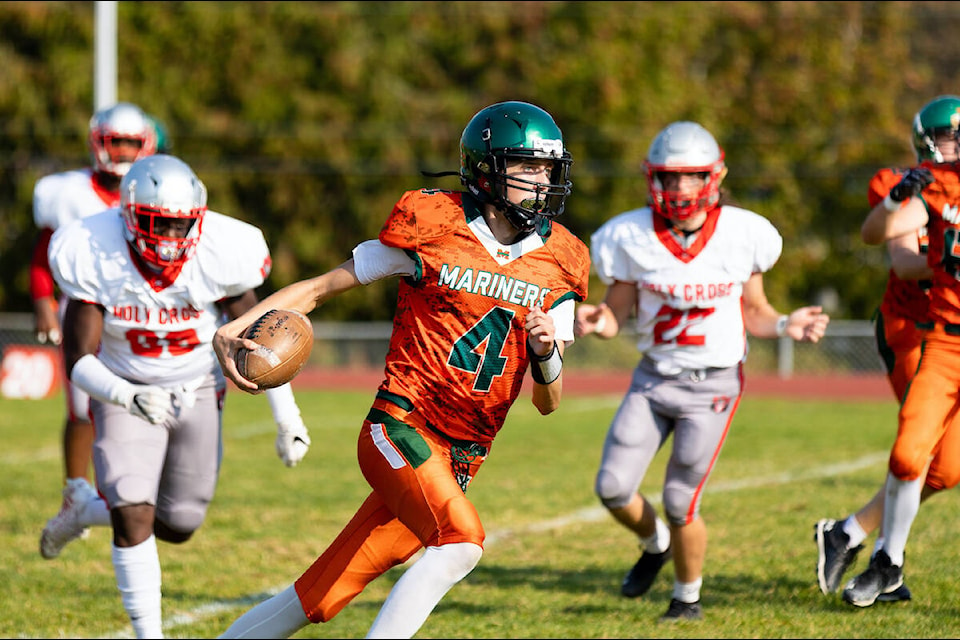 In high school football action, Holy Cross Crusaders (in white) defeated Earl Marriott Mariners 45-12 at the Catholic school in Fleetwood on Friday, Oct. 7, 2022. (Photo: Anna Burns)