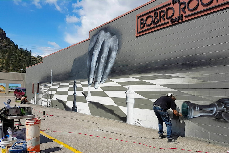 Archer decided on a playful theme for the Boardroom Cafe mural. (Photo by Chris Hammett)