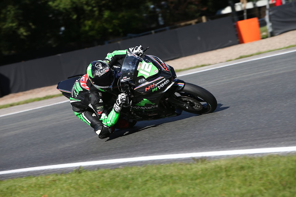 Above: South Surrey’s Jack Roach, 19, racing on the Oulton Park track in England in 2022. (Bonnie Lane/courtesy British Superbike) Far left: Roach with just some of the many trophies and awards he’s won racing. (Tricia Weel photo) Left: Roach with two of the young riders he trains through his junior academy, Sebastian Ochi, 7, and Martina Cardenas, 8. (contributed photo)