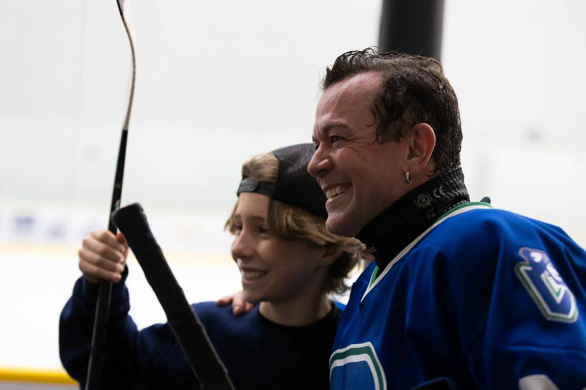 Gavin Beza, left, poses for a photo with Aaron Pritchett after the Fire & Ice charity game at WickFest at North Surrey Sport and Ice Complex in Surrey on Saturday, Feb. 4, 2023. (Photo: Anna Burns)