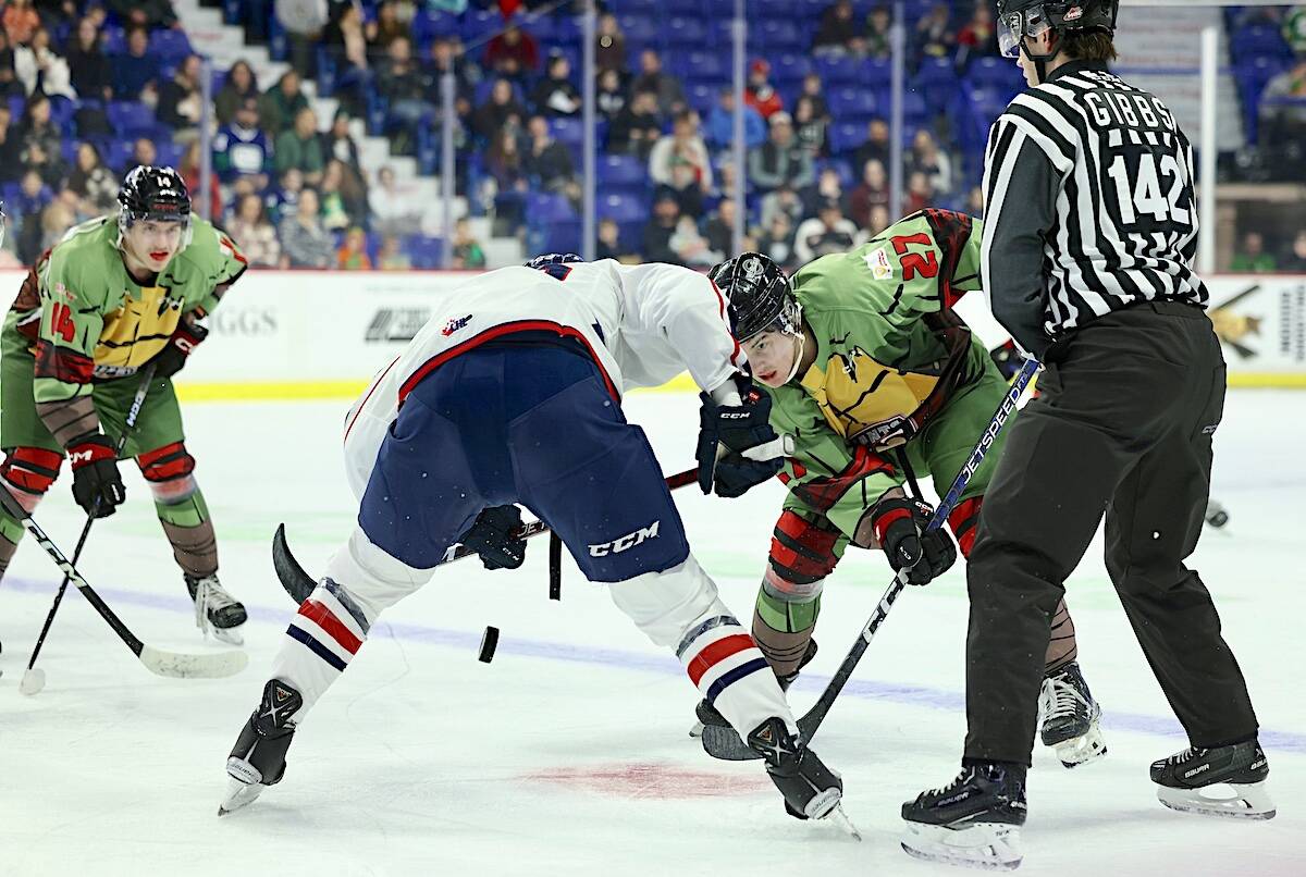 Kyren Gronick faced off for Vancouver Giants at the Langley Events Centre on Sunday afternoon, Feb. 5. with teammate Ethan Semeniuk in position on the left. (Rob Wilton/Special to Langley Advance Times)