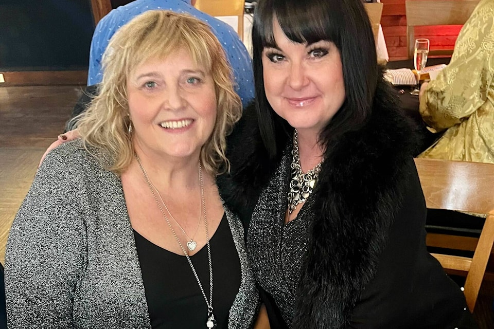 Actress Darla Fay, left, with Sherry Lang as the fun was just getting started at the White Rock Pride Society’s Oscars Viewing Party Sunday night at Softball City. (Tricia Weel photo)