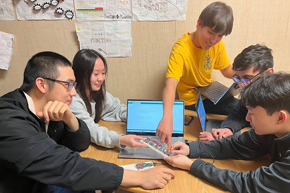 Semiahmoo Secondary’s two robotics teams help each other out ahead of a national competition that will see the two battling it out for the championship title. Right to left: Daniel Xu, Raelyn Xu, Shener Hasan, Roshan Ramchandani and Bowen Zhan. (Sobia Moman photo)