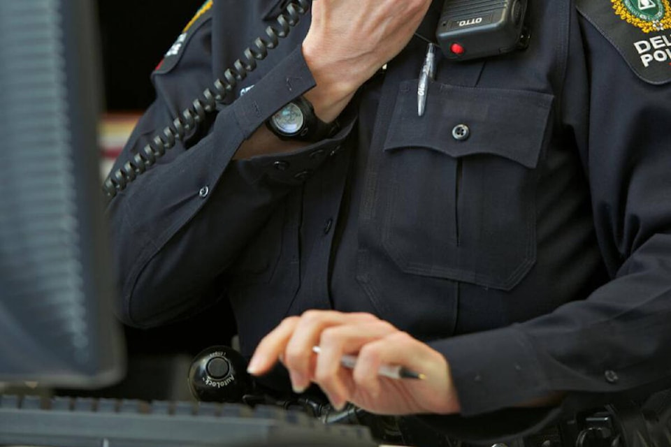 32708695_web1_211209-NDR-M-DPD-officer-on-phone-at-desk-CROP