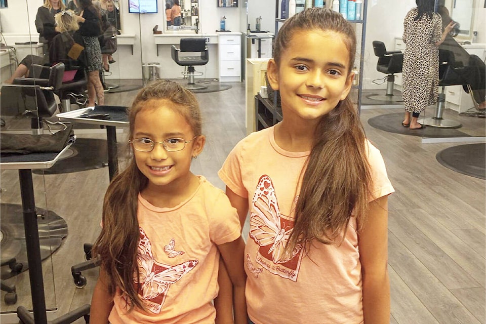 Eliza and Amelia Vanderark are seen before their haircuts May 31 at Michaud’s Hair Salon in Cloverdale. The Vanderark sisters are once again donating their hair to Wigs for Kids B.C. (Photo: Malin Jordan)