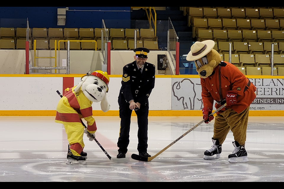 Safety Bear representing the RCMP and Sparky the Dog for the fire department, face off at Tamitik Arena Jan. 29 ahead of the Feb. 22 annual Guns and Hoses hockey match between the Kitimat RCMP and Fire Department. 