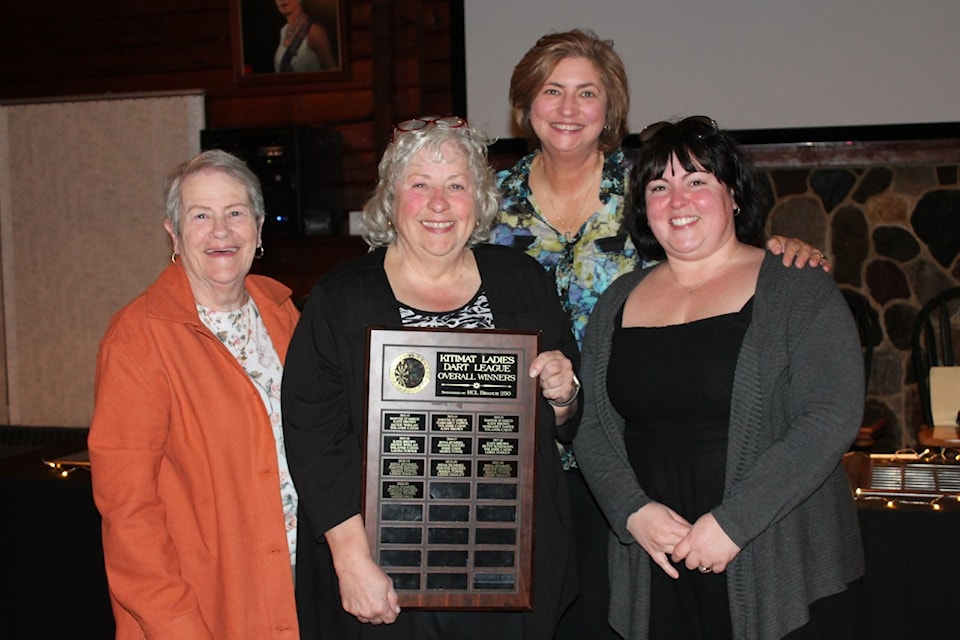 Overall league winners—Joanne Havery, Rena Hummel, Maria Towse and Leree Hall—celebrate their sixth consecutive first-place finish in the Kitimat Ladies Dart League.