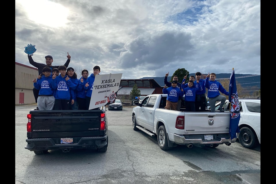The U13 Xa’isla basketball team celebrate during a parade in their honour through Kitamaat Village following their silver division championship win at the Junior All Native Basketball Tournament in Kelowna, March 16 to 21.