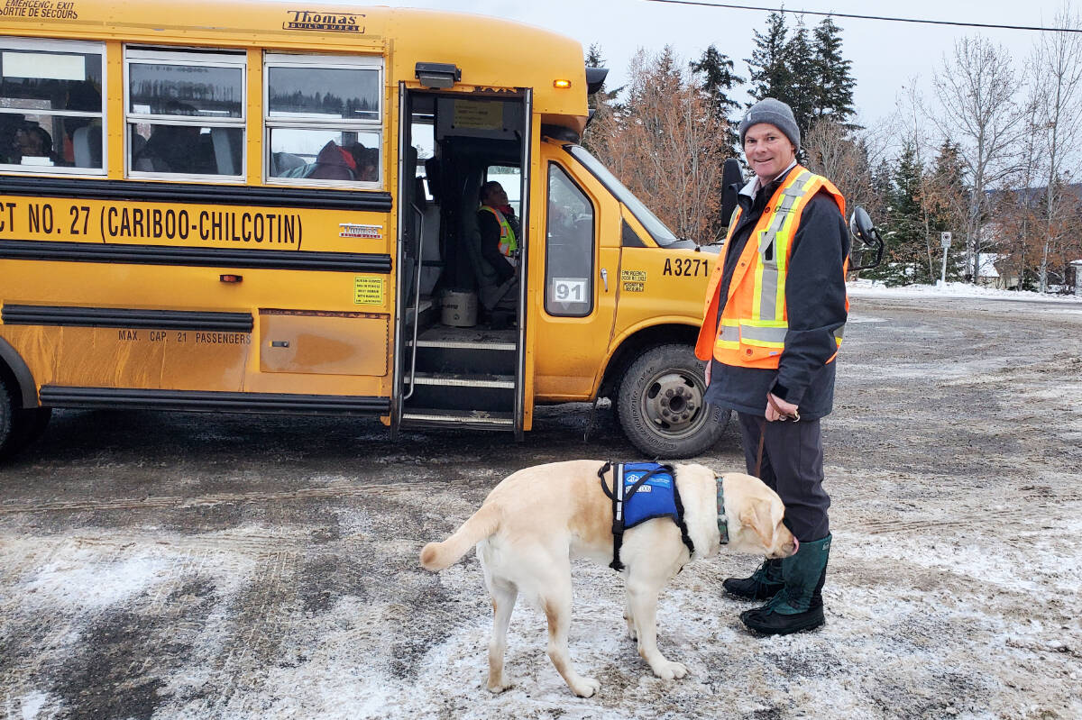 Most school days Chilcotin Road Elementary School principal Gregg Gaylord picks up Sam, the autism service dog, from the bus and takes him into Liams classroom. (Monica Lamb-Yorski photo - Williams Lake Tribune)
