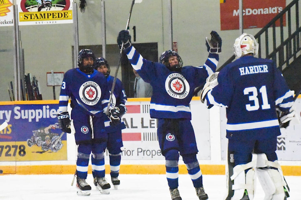 Northstars players celebrate a goal against the Island Hockey Club Sunday with their goalie, Rylan Harder. (Angie Mindus photos - Williams Lake Tribune)