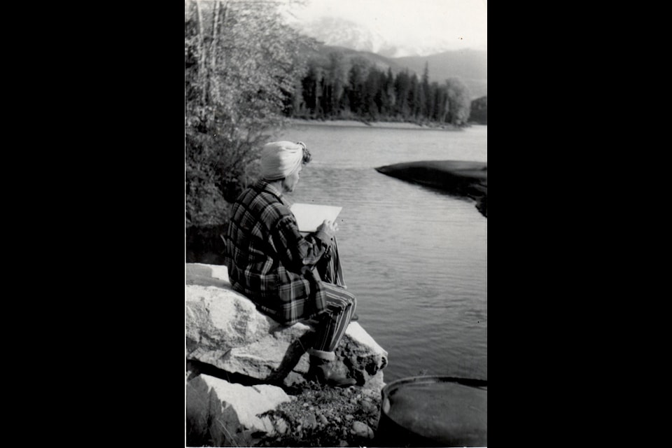 Elizabeth Linda Lowrie sketching the Skeena River and mountains near the fishing hole in Dorreen, B.C. in the mid- 1950s.