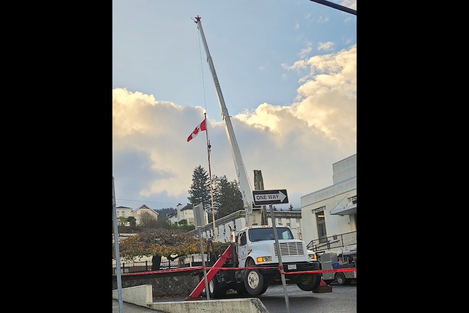 Broadwater Industries prepares to remove the old flagpole from City Hall on Oct. 24.