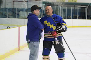 RCMP hoist Guns N' Hoses trophy on the back of great goaltending