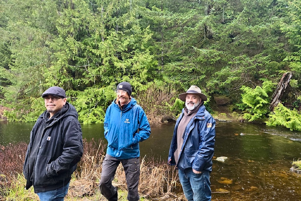 Mitch Clifton (left), Thomas Schoen (center) and Patrick Lucas (right) use the Cedar Trail in Bella Bella. 