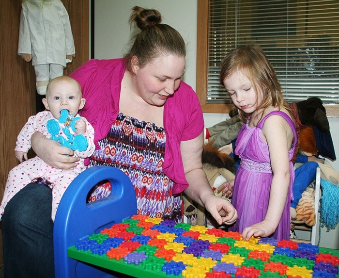 Sarah Browne plays with her neices Piper, 4, and Priya, six months.