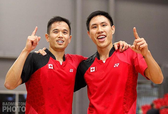 Adrian Liu and Derrick Ng celebrate a victory.