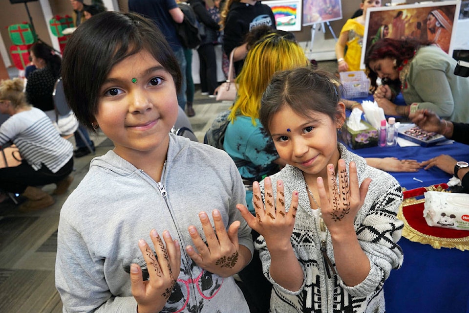 Hailey Thompson and Aura Azak show off the henna they had done on their hands at the Celebration of Multicultural Diversity on Nov. 25. (Shannon Lough / The Northern View) Hailey Thompson and Aura Azak show off the henna they had done on their hands at the Celebration of Multicultural Diversity on Nov. 25. (Shannon Lough / The Northern View)