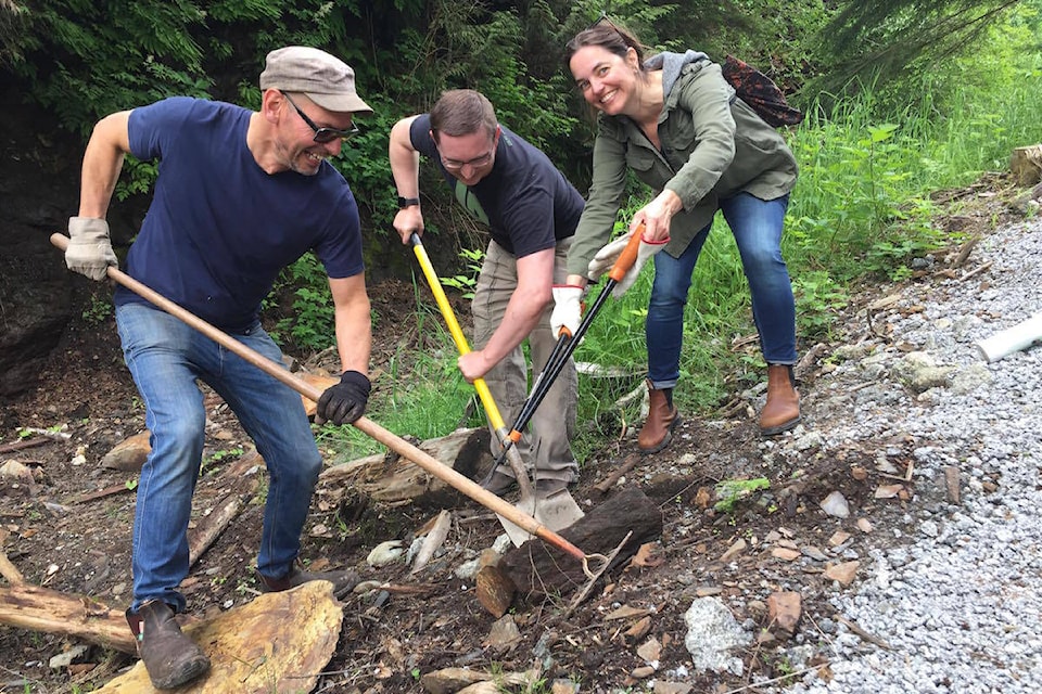 David Smooke, Hans Seidemann, and Lucy Pribas volunteering at the Rushbrook Trail spring spruce up, June 15, 2019. (Jenna Cocullo/ The Northern View)
