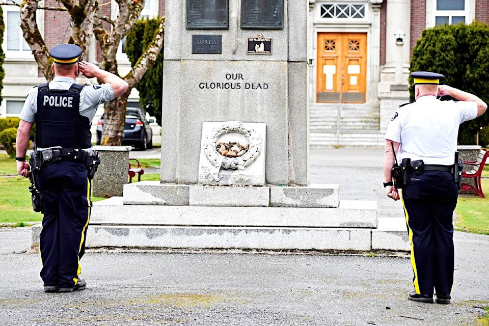 Prince Rupert RCMP officers stand at full salute on April 24, to pay respect in honour of fallen Nova Scotia RCMP Officer Const. Heidi Stevenson, who was killed while on active as duty she responded to an active shooter incident where more than 22 victims lives were claimed. (Photo: K-J Millar/The Northern View)